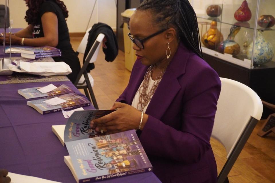 AnneMarie Mingo signs her book titled “Have You Got Good Religion?: Black Women’s Faith, Courage, and Moral Leadership in the Civil Rights Movement” at an event Monday at the Cotton Club Museum and Cultural Center in SE Gainesville.
(Credit: Photo provided by Voleer Thomas, Special to The Sun)