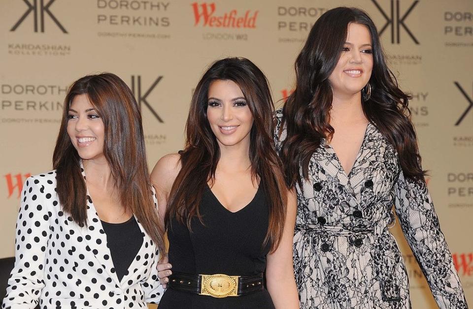 Kourtney, Kim, and Khloé on a red carpet