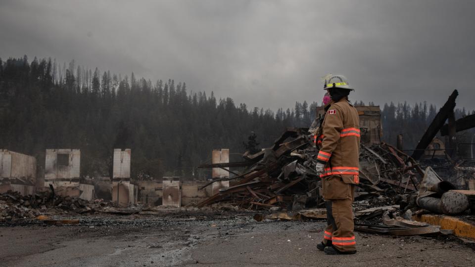 Firefighter at remains of Maligne Lodge, Jasper