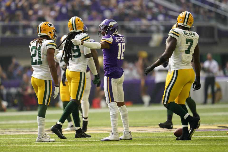 Minnesota Vikings wide receiver Justin Jefferson (18) celebrates after catching a pass for a first down during the first half of an NFL football game against the Green Bay Packers, Sunday, Sept. 11, 2022, in Minneapolis. (AP Photo/Abbie Parr)