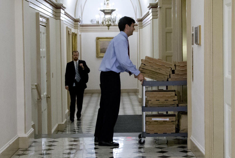 A trolly loaded with pizza is wheeled onto the elevator that serves the office of House Speaker John Boehner of Ohio, on Capitol Hill, Tuesday, Oct. 15, 2013, in Washington. (AP Photo/Carolyn Kaster)