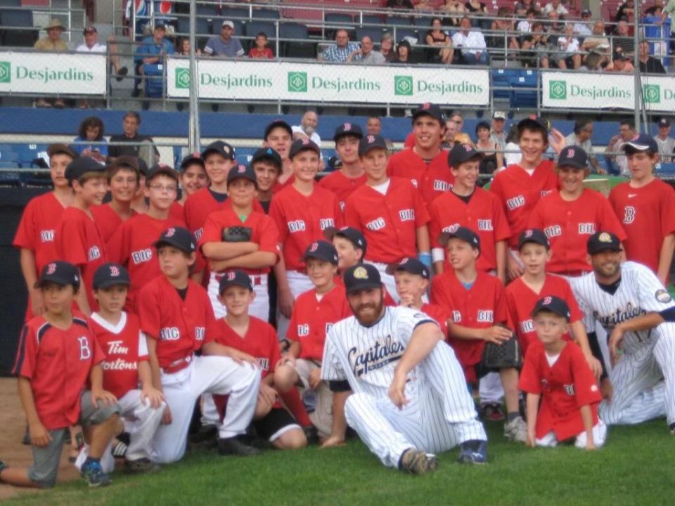 Anthony Quirion pictured centre, with his Coaticook baseball team. He visited the Canac Stadium when he was 13 years old.