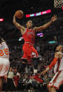 CHICAGO, IL - MARCH 12: Derrick Rose #1 of the Chicago Bulls goes up for a dunk between Baron Davis #85 and Tyson Chandler #6 of the New York Knicks on his way to a game-high 32 points at the United Center on March 12, 2012 in Chicago, Illinois. The Bulls defeated the Knicks 104-99. NOTE TO USER: User expressly acknowledges and agrees that, by downloading and or using this photograph, User is consenting to the terms and conditions of the Getty Images License Agreement. (Photo by Jonathan Daniel/Getty Images)