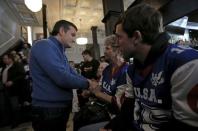 U.S. Republican presidential candidate Ted Cruz greets attendees at a campaign event in Centerville, Iowa, United States, January 26, 2016. REUTERS/Jim Young