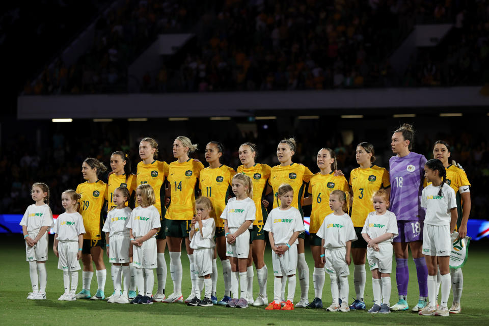 The Matildas line-up for the national anthem.