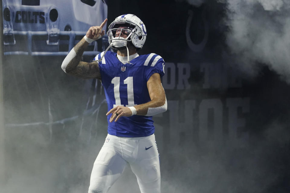 Indianapolis Colts wide receiver Michael Pittman Jr. (11) gestures as he walks on the field during player introductions before an NFL football game against the Tampa Bay Buccaneers, Nov. 26, 2023, in Indianapolis. The Colts are closing in on a three-year, $70 million deal to keep Pittman Jr, a person with knowledge of the deal told The Associated Press. The person spoke to the AP on condition of anonymity because the deal is being finalized. (AP Photo/Darron Cummings, file)