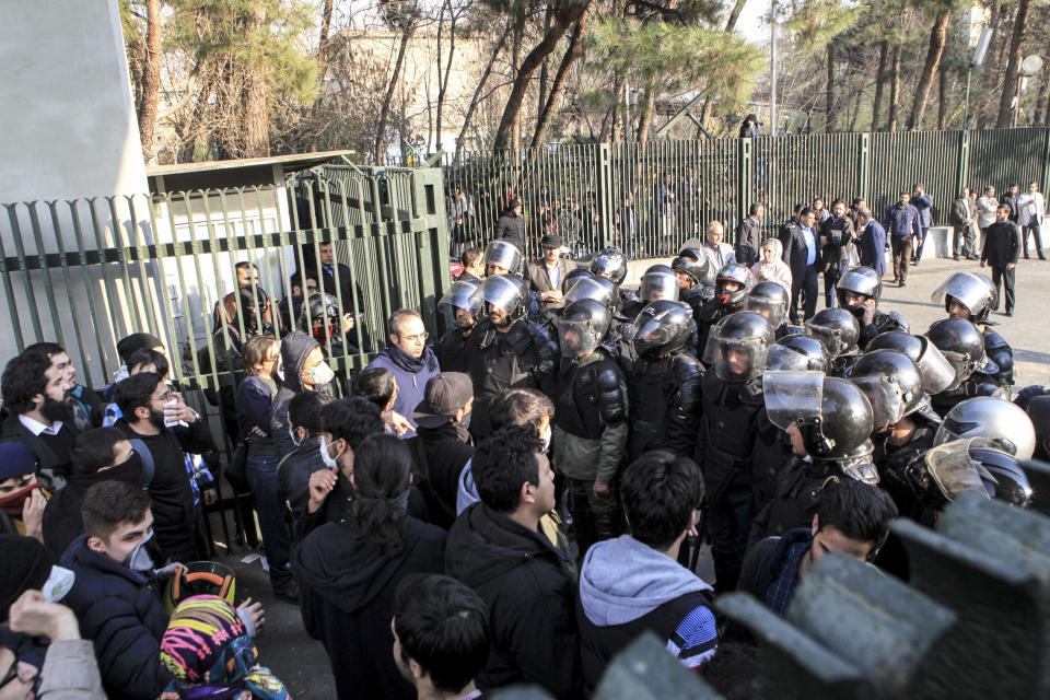 <p>In this photo taken by an individual not employed by the Associated Press and obtained by the AP outside Iran, anti-riot Iranian police prevent university students to join other protesters over Iran weak economy, in Tehran, Iran, Saturday, Dec. 30, 2017. (Photo: AP) </p>