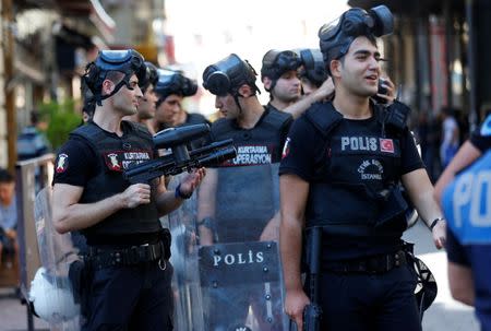 Riot police stand guard as LGBT rights activists try to gather for a pride parade, which was banned by the governorship, in central Istanbul, Turkey, June 25, 2017. REUTERS/Murad Sezer