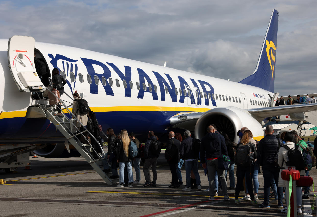 Passengers board Ryanair airplane
