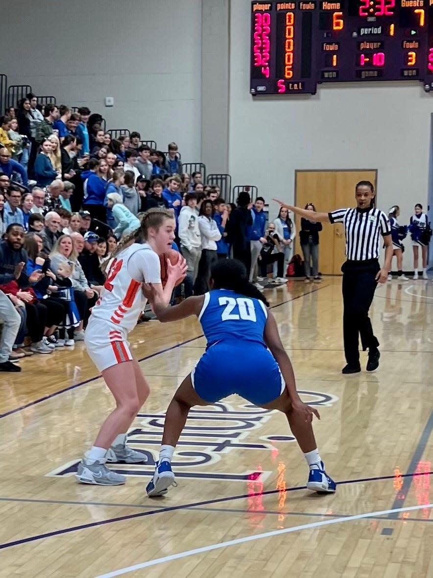 North Union's Allison Price squares up against the defense of Bexley's Madison Ingram during a Division II girls basketball district championship game Saturday at Capital University.