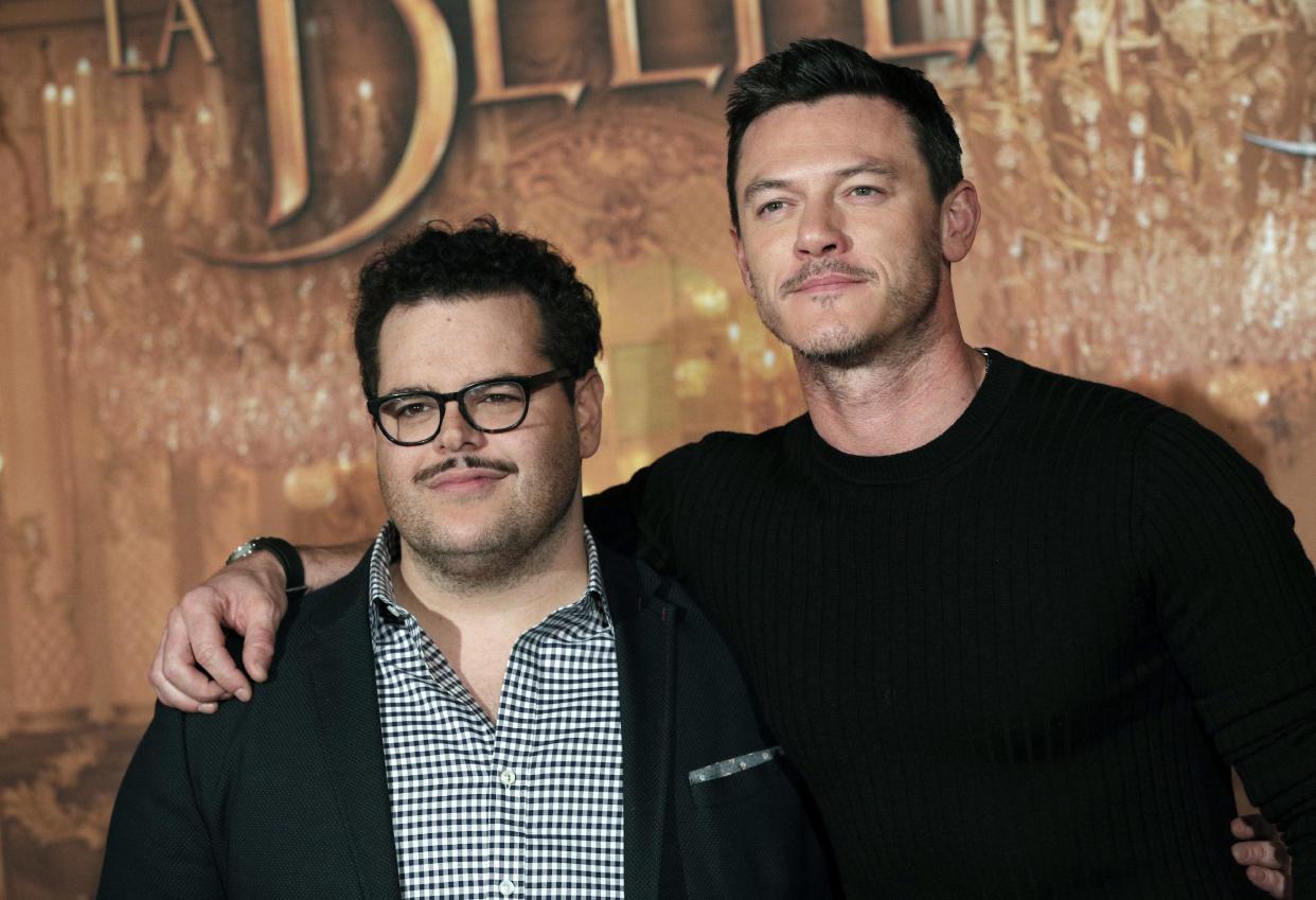 Actor Josh Gad, left, who plays manservant LeFou, and Luke Evans who plays villain Gaston, pose during a promotional event for the movie “Beauty and the Beast”, in Paris. The movie includes a “gay moment” between the two characters in the film. (AP Photo/Christophe Ena, File)