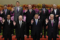 From left in front row, Indonesian President Joko Widodo, Russian President Vladimir Putin, Chinese President Xi Jinping and Kazakhstan President Kassym-Jomart Tokayev with other leaders wave during a group photo session at the Belt and Road Forum in Beijing Wednesday, Oct. 18, 2023. (Suo Takekuma/Pool Photo via AP)