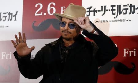 Actor Johnny Depp poses during a photo session ahead of a news conference for his movie "Mortdecai" in Tokyo January 28, 2015. REUTERS/Toru Hanai