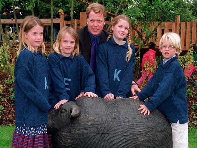 <p>Ken Goff/Getty</p> Earl Spencer with his children Amelia, Eliza, Kitty and Louis at the official opening of the Princess of Wales Memorial Playground and Walk in Kensington Gardens.