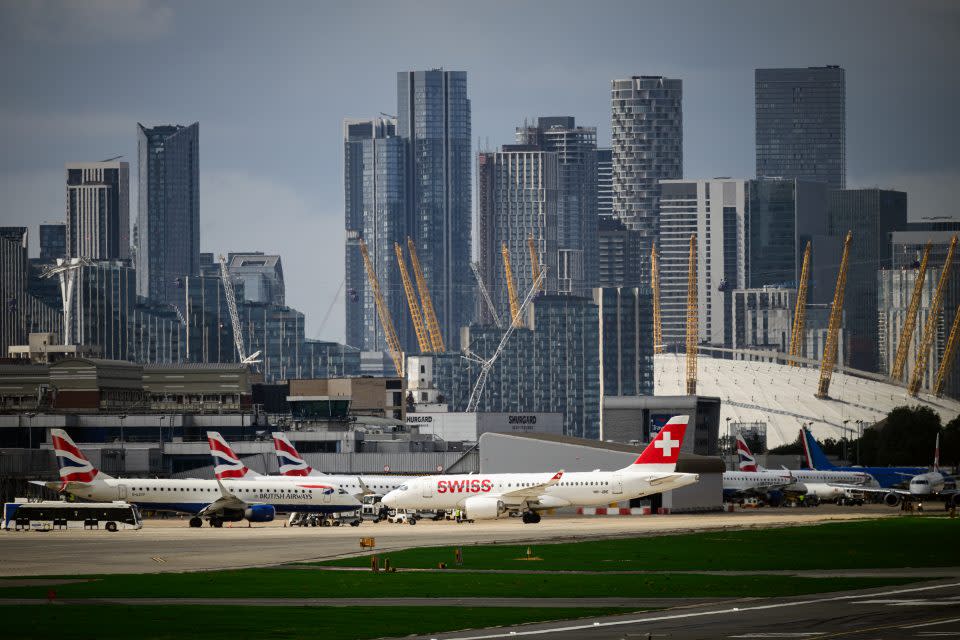 A row of commercial flights at the London City Airport. 