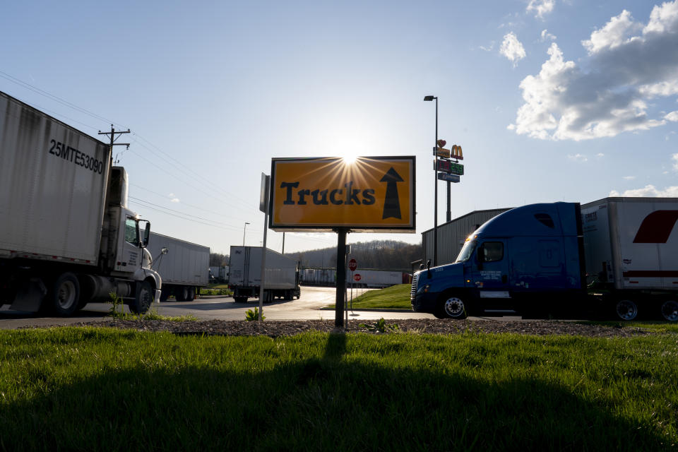 In this April 6, 2020, photo, semitrucks head to the truck parking lot at the Love's Travel Stop truck stop in Greenville, Va. During the coronavirus outbreak truckers continue to work so the supply chain is not disrupted. (AP Photo/Carolyn Kaster)