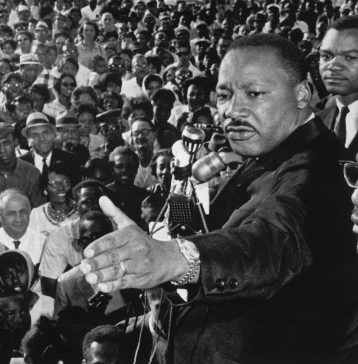 The Rev. Martin Luther King Jr. addresses a cheering crowd in Cleveland, Ohio, on July 27, 1965. <a href="https://www.gettyimages.com/detail/news-photo/reverend-martin-luther-king-addressed-a-cheering-crowd-of-2-news-photo/517475132?phrase=martin%20Luther%20King&adppopup=true" rel="nofollow noopener" target="_blank" data-ylk="slk:Bettmann/Getty Images;elm:context_link;itc:0;sec:content-canvas" class="link ">Bettmann/Getty Images</a>