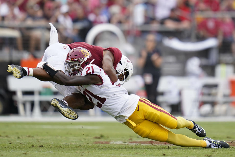 Southern California defensive back Latrell McCutchin (21) tackles Stanford wide receiver Elijah Higgins during the first half of an NCAA college football game in Stanford, Calif., Saturday, Sept. 10, 2022. (AP Photo/Godofredo A. Vásquez)