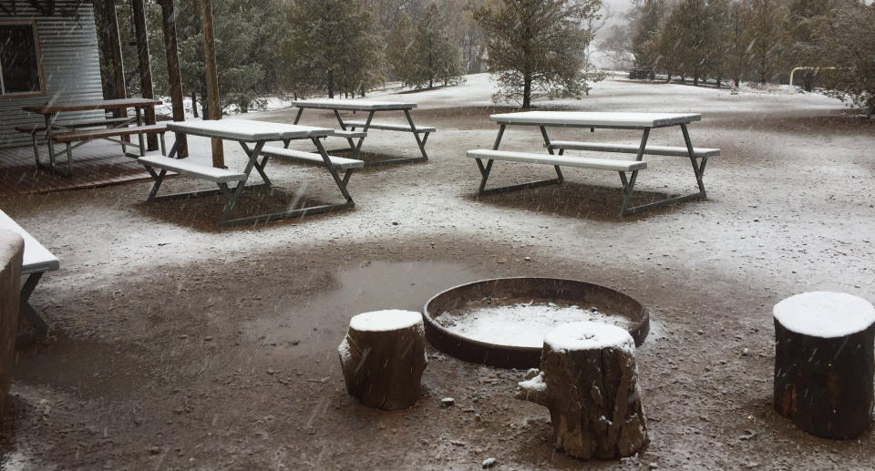 Snow covering the ground and picnic tables at Skytrek Willow Springs Station, South Australia.