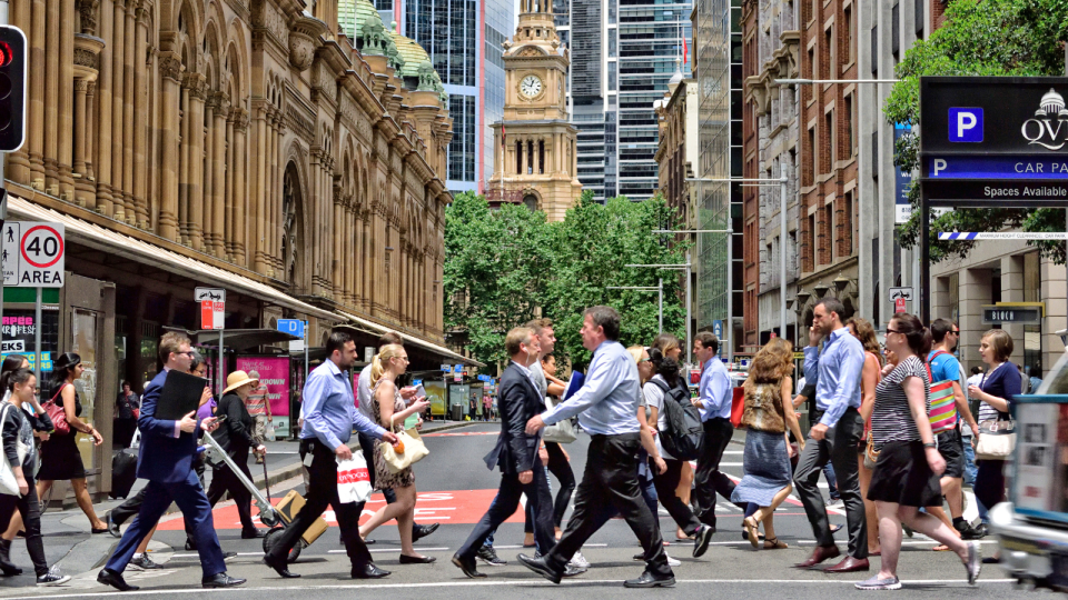 Australian workers walking to work in the city. Mental health.