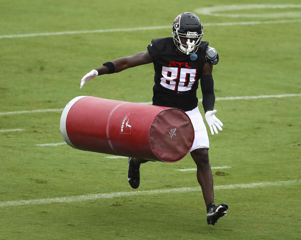 Atlanta Falcons wide receiver Laquon Treadwell hits a tackling dummy during an NFL football training camp practice in Flowery Branch, Ga., Monday, Aug. 24, 2020. (Curtis Compton/Atlanta Journal-Constitution via AP, Pool