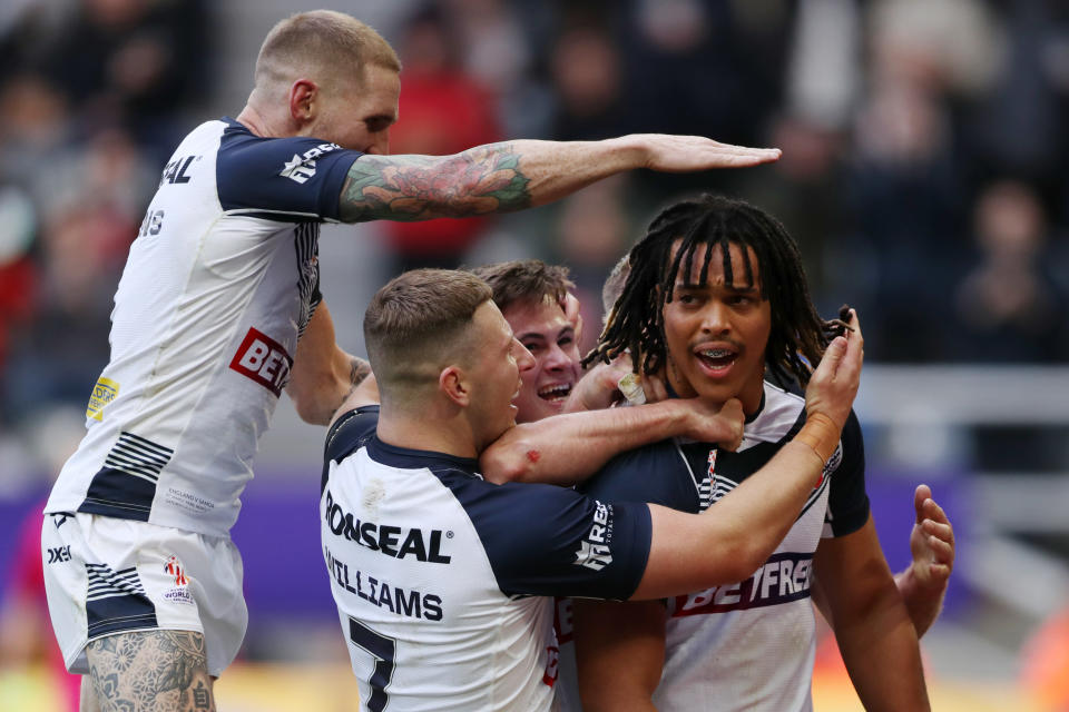 NEWCASTLE UPON TYNE, ENGLAND - OCTOBER 15: Dom Young of England celebrates with teammates after scoring their sides second try during the Rugby League World Cup 2021 Pool A match between England and Samoa at St. James Park on October 15, 2022 in Newcastle upon Tyne, England. (Photo by Charlotte Tattersall/Getty Images for RLWC)