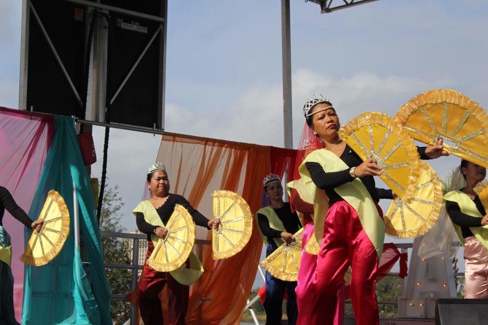 The Filipino American Association of Coastal Georgia performs the traditional fan dance at Savannah 2022 AAPI festival, "The Colors of Asia".