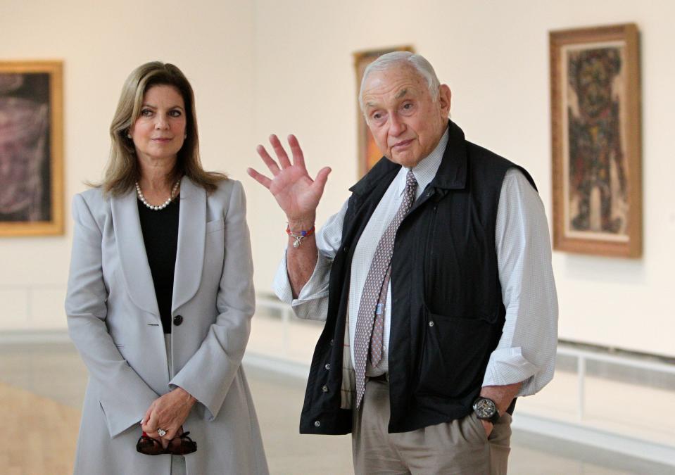 This Sept. 19, 2014, file photo shows retail mogul Leslie Wexner, right, and his wife, Abigail, as they  tour the 