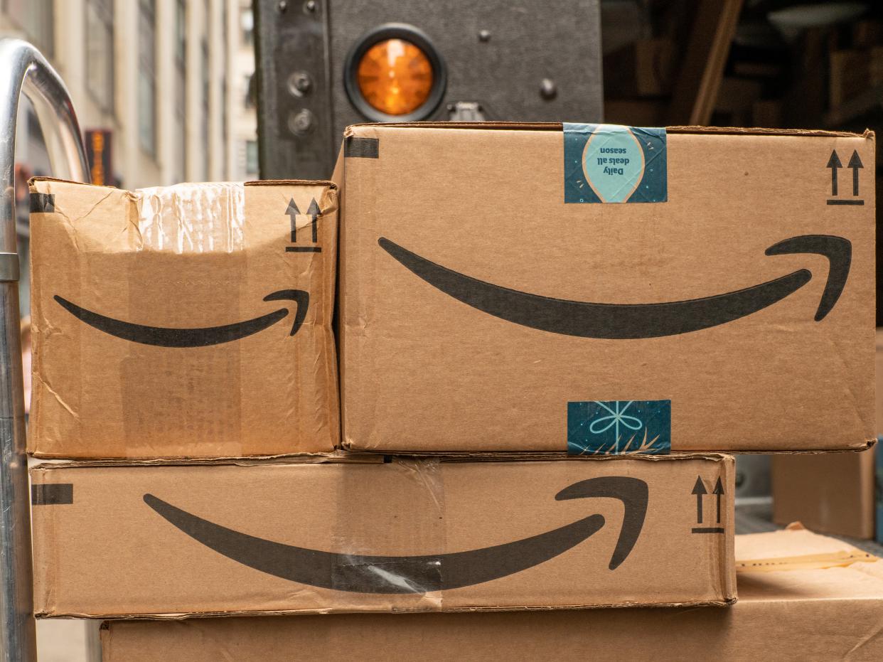 A hand-truck with Amazon packages waits to be delivered on 27 December 2019 in New York City (Getty Images)