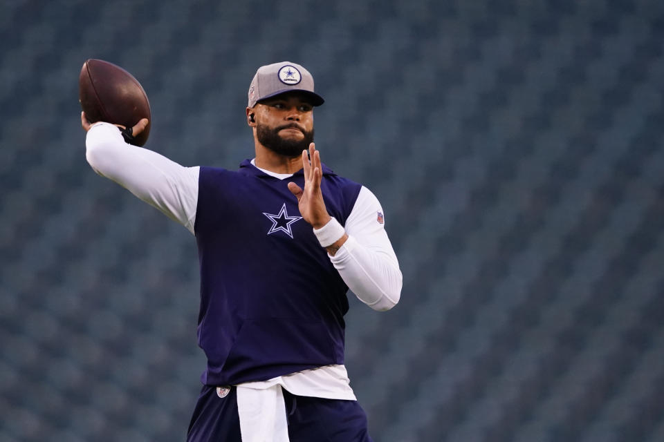 Dallas Cowboys' Dak Prescott warms up before an NFL football game, Sunday, Oct. 16, 2022, in Philadelphia. Prescott gave himself an “A” but said he's looking for an “A-plus” after a throwing session prior to being inactive a fifth consecutive week in Dallas' NFC East showdown with Philadelphia. (AP Photo/Matt Slocum)