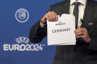 UEFA president Aleksander Ceferin, announces that Germany will stage the 2024 European Championships, during the Euro 2024 Host Announcement Ceremony, at the UEFA Executive Committee at the UEFA Headquarters, in Nyon, Switzerland, Thursday, Sept. 27, 2018. (Martial Trezzini/Keystone via AP)