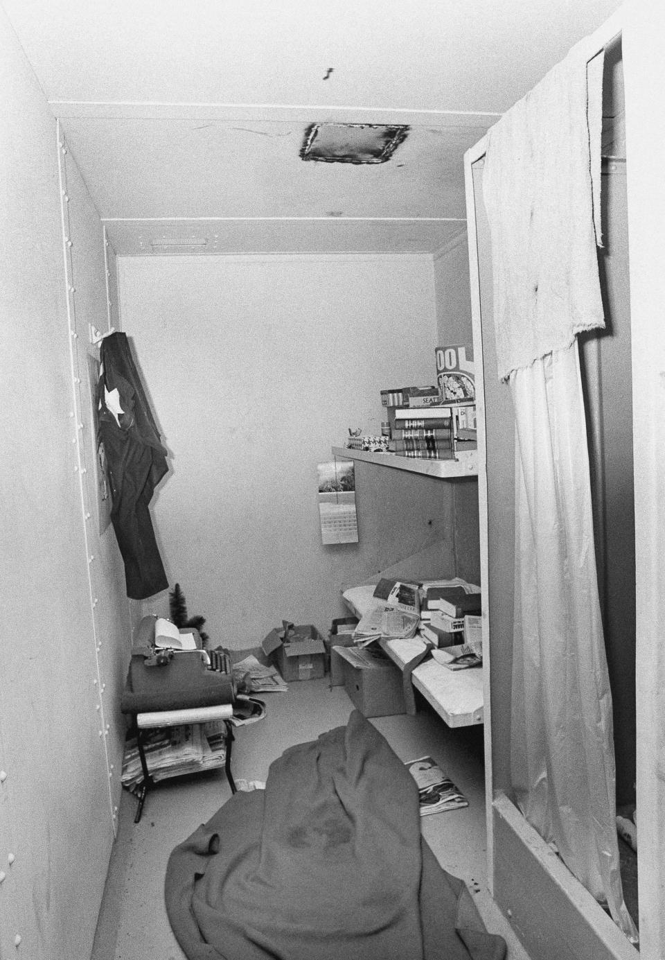 FILE - This 1977 file photo shows the jail cell from which suspected serial killer Ted Bundy escaped on Dec. 30, 1977, in Glenwood Springs, Colo. Bundy piled books under the blankets of his cot to make it appear that he was sleeping, and then cut a hole in the ceiling and climbed to the crawlspace, becoming a fugitive for the second time. (Ross Dolan/Glenwood Springs Post-Independent via AP)