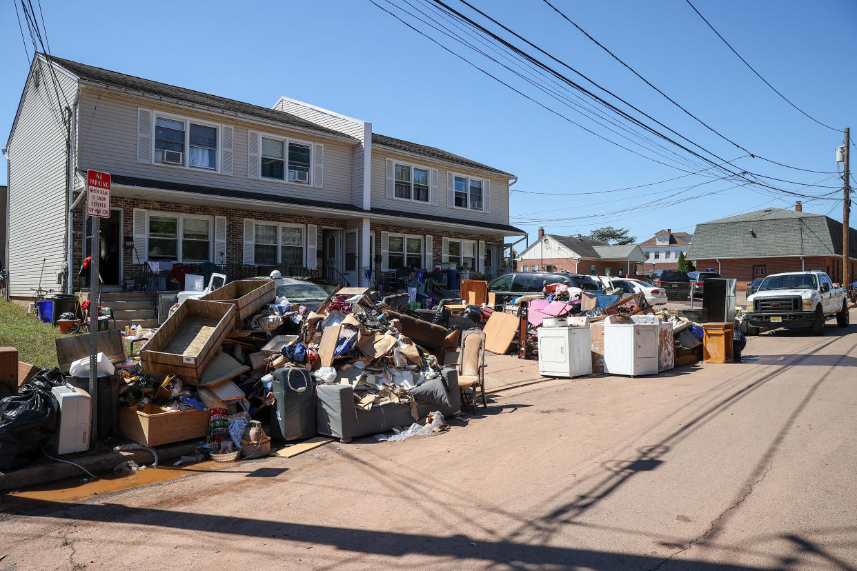 Residents in Manville, N.J., left their belongings on the sidewalk after heavy rain from Hurricane Ida on Tuesday.