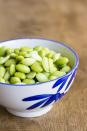 <p>Edamame packs 9 grams of muscle-building <a href="https://www.prevention.com/food-nutrition/healthy-eating/a20514733/high-protein-vegetables-and-plant-based-food/" rel="nofollow noopener" target="_blank" data-ylk="slk:plant protein;elm:context_link;itc:0;sec:content-canvas" class="link ">plant protein</a> in just ½ cup for less than 100 calories. These versatile soybeans are also a great source of <a href="https://www.prevention.com/food-nutrition/a23012367/folate-deficiency-symptoms/" rel="nofollow noopener" target="_blank" data-ylk="slk:folate;elm:context_link;itc:0;sec:content-canvas" class="link ">folate</a> (vitamin B9), <a href="https://www.prevention.com/food-nutrition/healthy-eating/g20465791/8-foods-that-have-more-iron-than-beef/" rel="nofollow noopener" target="_blank" data-ylk="slk:iron;elm:context_link;itc:0;sec:content-canvas" class="link ">iron</a>, vitamins C and A, and potassium for your heart.<strong><br></strong></p><p><strong>Try it:</strong> Roast some with flaky sea salt or perk up your favorite pasta dish with a handful (we love this <a href="https://www.prevention.com/food-nutrition/recipes/a20523162/lemony-shells-with-edamame/" rel="nofollow noopener" target="_blank" data-ylk="slk:lemony shells with edamame recipe;elm:context_link;itc:0;sec:content-canvas" class="link ">lemony shells with edamame recipe</a>).</p>