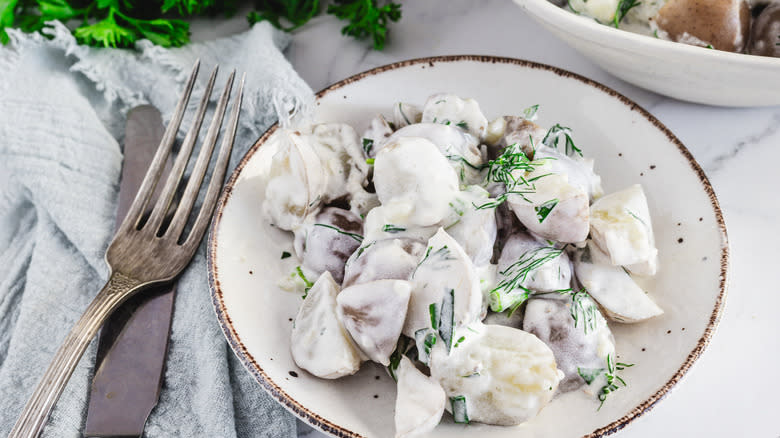 Buttermilk ranch potato salad in bowl with fork