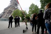 Eiffel Tower closed as man climbs upper section of 1,000ft Paris landmark