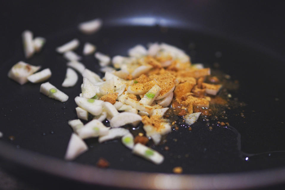 Sauteeing garlic with spices.