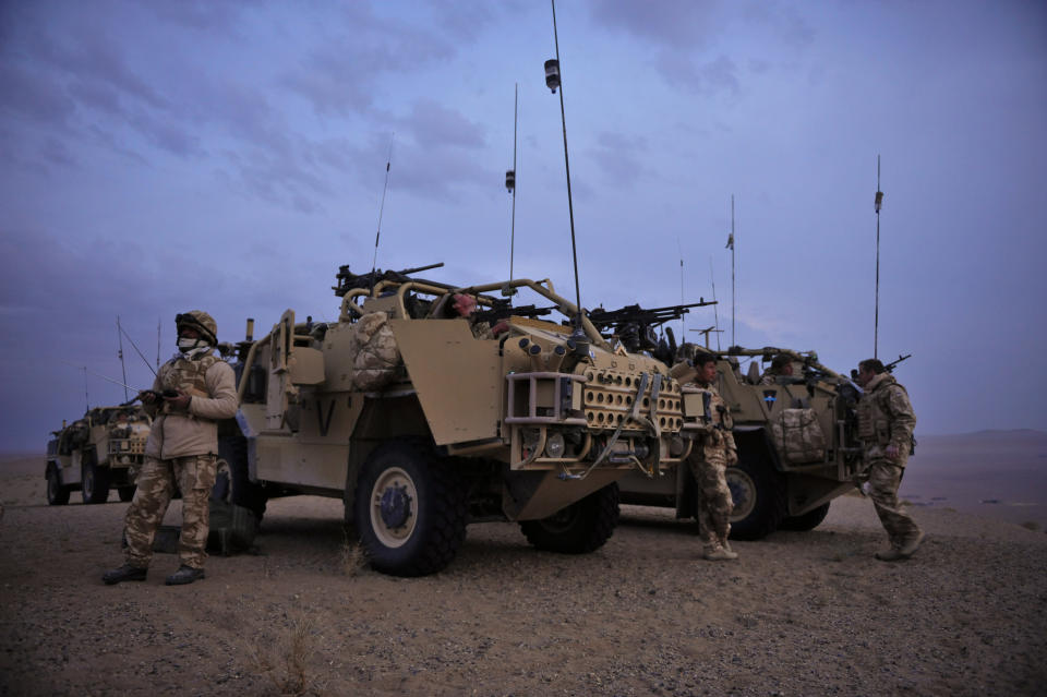 Night draws in as the sun sets on a ridge in the Eastern desert where troops from the 1st The Queens Dragoon Guards observed a fire fight between the Taliban and the Afghan National Army in the Nawa region of Helmand Province near the Eastern desert.