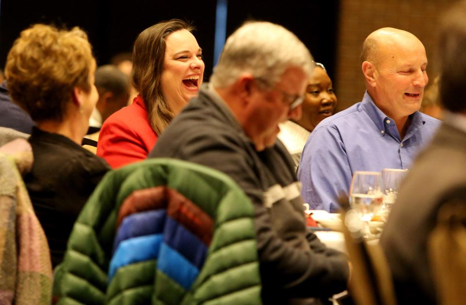 Elizabeth Bennion, professor of political science and director of community engagement at Indiana University South Bend, laughs at her seat before she receives the Roland Kelly Award Monday, Jan. 15, 2024, at the annual Dr. Martin Luther King Jr. Community Service Recognition Breakfast at Century Center in South Bend.