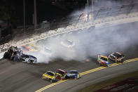 DAYTONA BEACH, FL - FEBRUARY 18: Jeff Gordon, driver of the #24 Drive to End Hunger Chevrolet, and Kurt Busch, driver of the #51 Tag Heuer Avant-Garde Chevrolet Chevrolet, and Jimmie Johnson, driver of the #48 Lowe's Chevrolet, crash in front of the pack during the NASCAR Budweiser Shootout at Daytona International Speedway on February 18, 2012 in Daytona Beach, Florida. (Photo by Jamie Squire/Getty Images)
