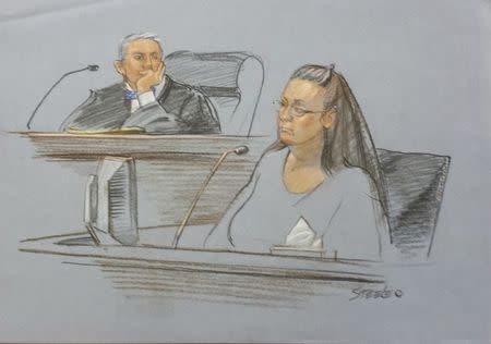 Rowan County clerk Kim Davis (R) is shown in this courtroom sketch during her contempt of court hearing for her refusal to issue marriage certificates to same-sex couples, at the United States District Court in Ashland, Kentucky, September 3, 2015. REUTERS/Marlene Steele