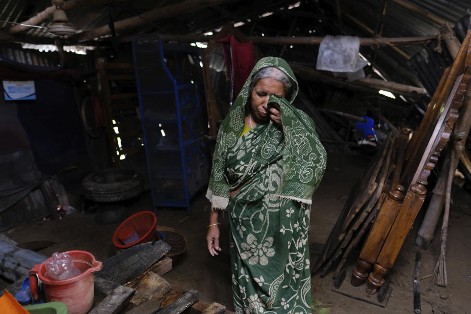 Bangladeshi woman Hasiba wails after visiting her home damaged in floods in Sylhet, Bangladesh, Wednesday, June 22, 2022. (AP Photo/Mahmud Hossain Opu)