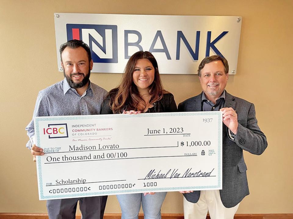 Chad Pfief of InBank (left) presents Madison Lovato, a Pueblo West student with a $1,000 scholarship with the help of Mike Van Norstrand, executive director of Independent Community Bankers of Colorado.