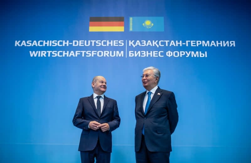 German Chancellor Olaf Scholz (L) takes part in a visit to the German-Kazakh Economic Forum alongside Kassym-Shomart Tokayev,President of Kazakhstan. Michael Kappeler/dpa