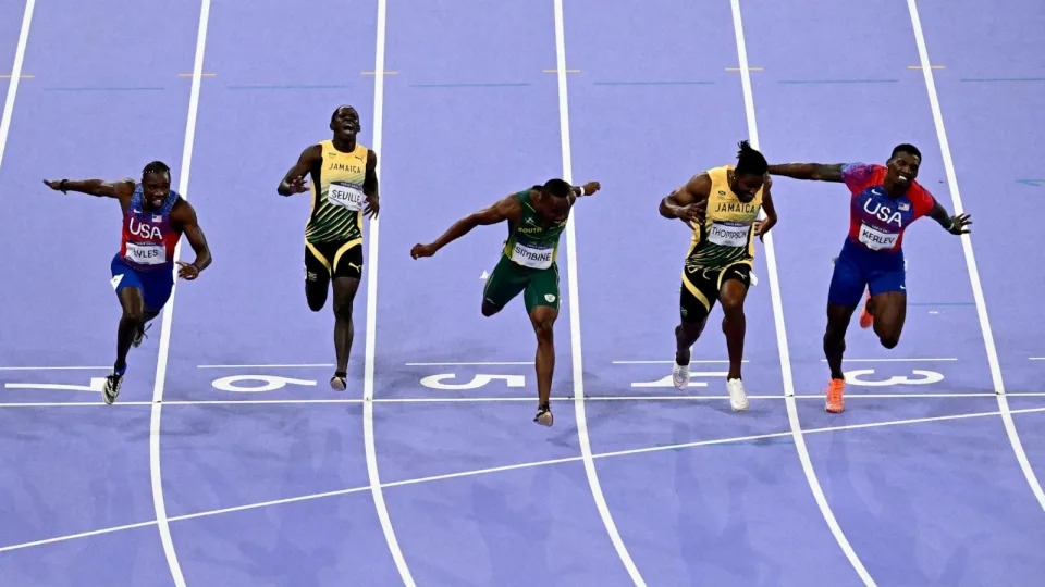 PHOTO: Noah Lyles of the U.S crosses the finish line to win the men's 100m final at the 2024 Paris Olympic Games, Aug. 4, 2024. (Loic Venance/AFP via Getty Images)