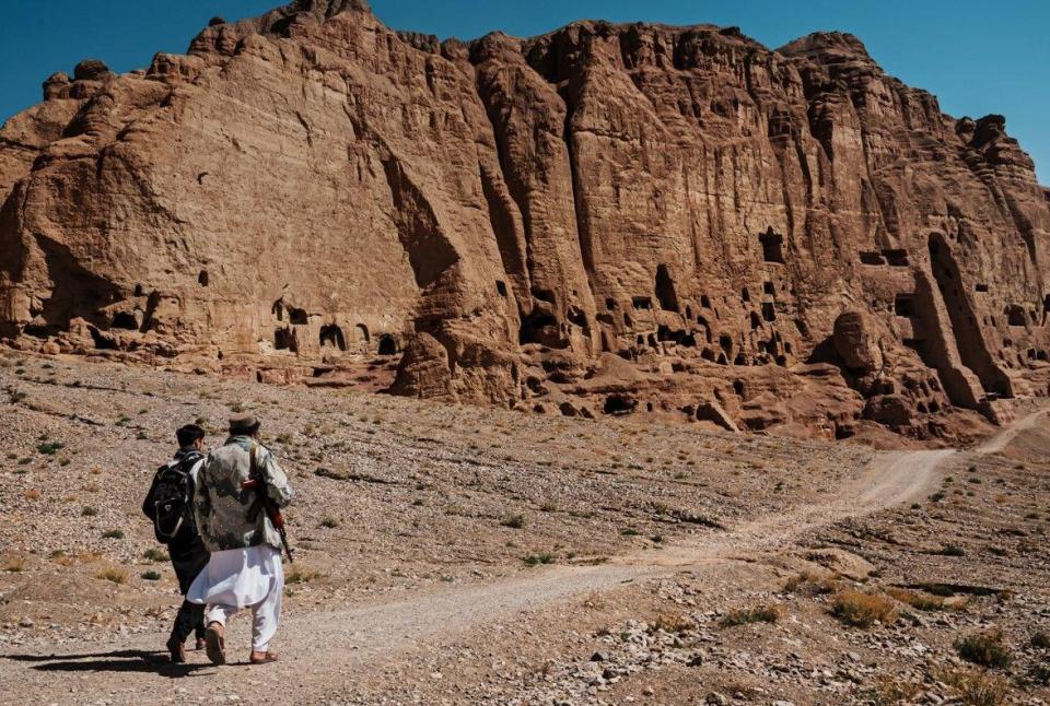 Afghans visit the historic sites carved into a side of a mountain where the Buddha statues once stood before the Taliban destroyed it in their previous reign in 2001, Bamyan, Afghanistan, Saturday, Sept. 24, 2022