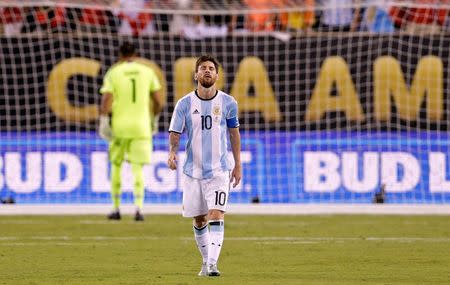 Jun 26, 2016; East Rutherford, NJ, USA; Argentina midfielder Lionel Messi (10) reacts after missing a shot during the shoot out round against Chile in the championship match of the 2016 Copa America Centenario soccer tournament at MetLife Stadium. Chile won. Mandatory Credit: Adam Hunger-USA TODAY Sports