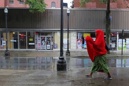 A Somali woman walks along a street in downtown Lewiston, Maine June 1, 2015. REUTERS/Brian Snyder