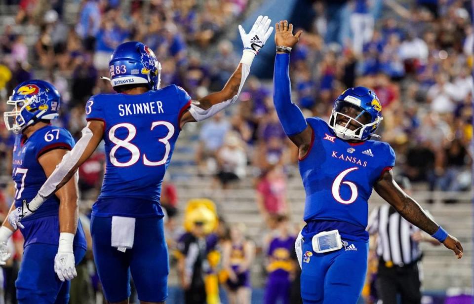 Kansas quarterback Jalon Daniels (6) celebrates with wide receiver Quentin Skinner (83) after scoring a touchdown against the Tennessee Tech Golden Eagles during the first half at David Booth Kansas Memorial Stadium on Sept. 2, 2022.