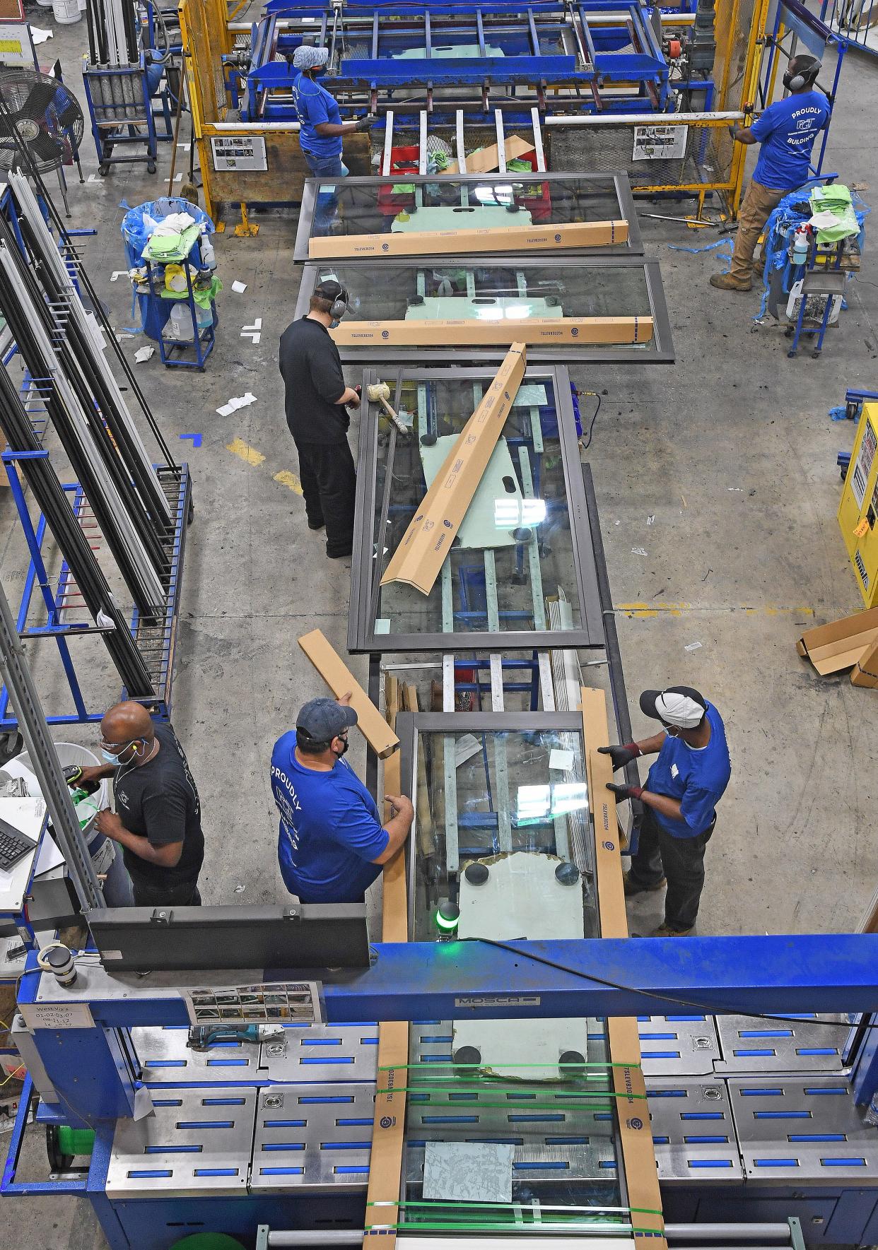 Here the PGT WinGuard Sliding Glass Doors assembly line area. PGT Innovations, the largest employer in Sarasota County and manufacturer of weather-resistant windows and doors, found its own way to adjust during COVID.